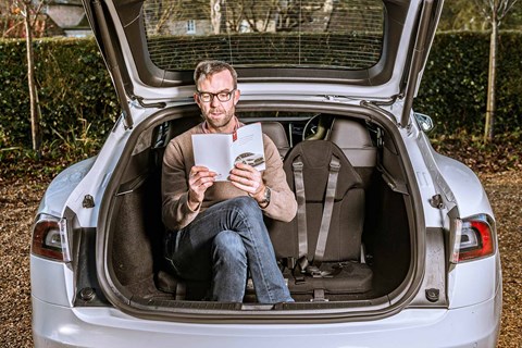 Tim Pollard tests the third-row seating in the Tesla Model S