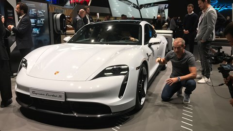 Porsche Taycan at the Frankfurt motor show 2019 - front view with man photographing wheel