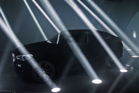 BMW X6 in Vantablack at the Frankfurt motor show 2019 - side view, probably, surrounded by spotlights