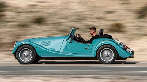 Turquoise 2020 Morgan Plus Four side elevation driving