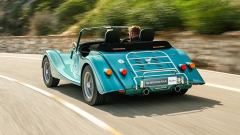 Turquoise 2020 Morgan Plus Four rear three-quarter driving