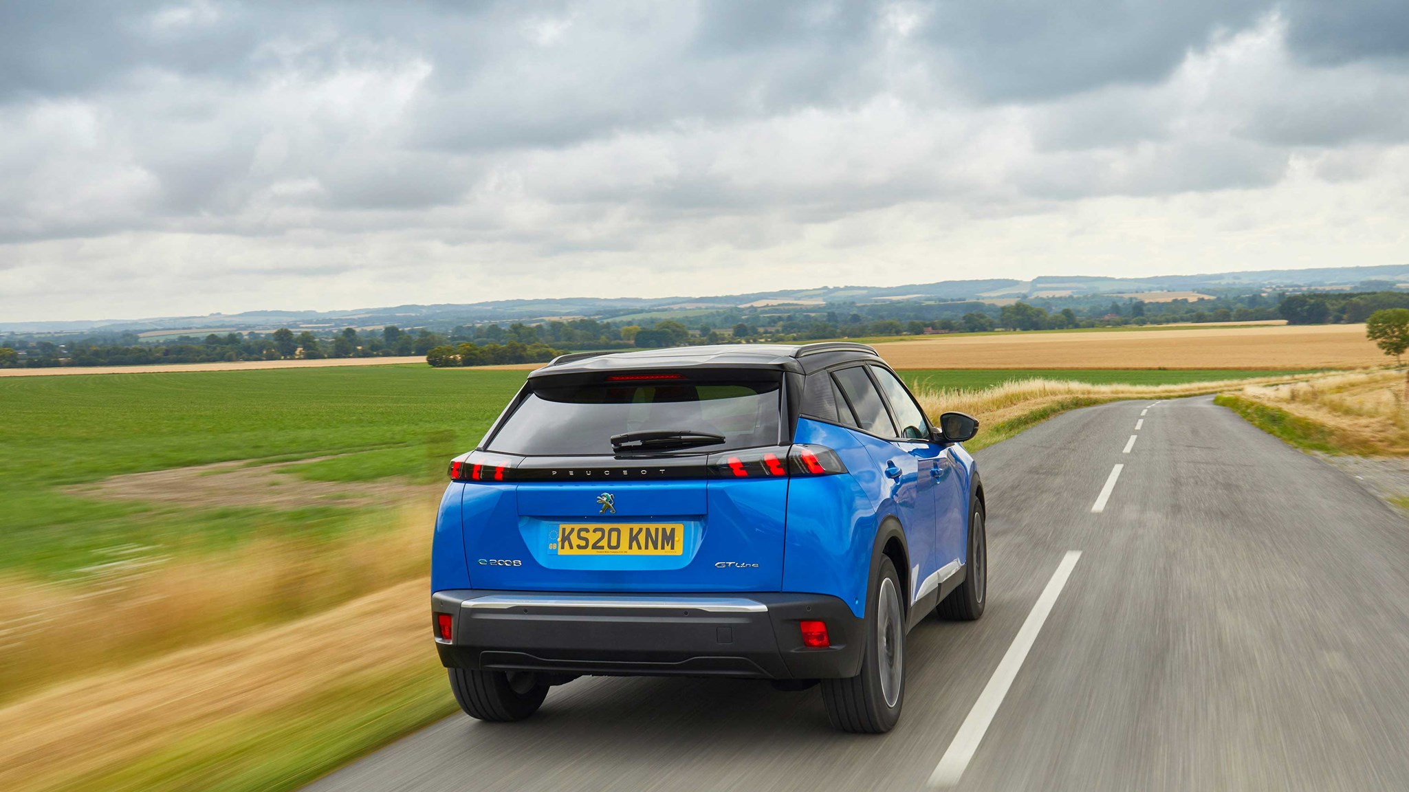 Peugeot e-2008 rear driving shot (UK spec)