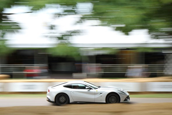 A Ferrari F12 blats up the hill on Thursday at the Moving Motor Show