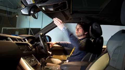 Forget buttons - in the future gestures likie waving will operate minor controls in Jaguar and Land Rovers