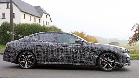 New 2023 BMW i5 spy shots: side rolling image, camouflaged car, road testing