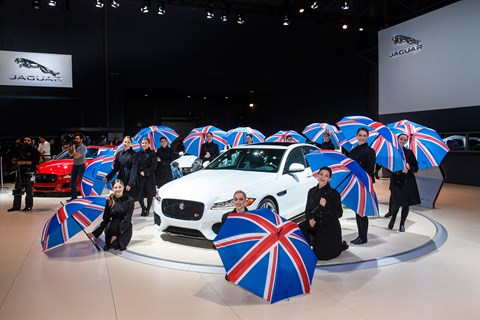 Brits ahoy! Union Flag-toting umbrellas ward off rain at Jaguar XF world debut