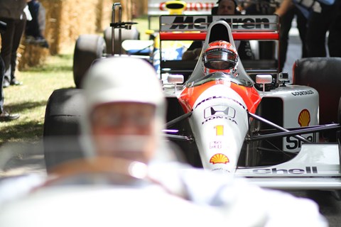 Stirling Moss in his Mercedes W196 queues up in front of Jenson Button in Senna's McLaren MP4/6