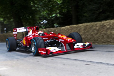 Kimi Raikkonen took his 2010 Ferrari grand prix car, the F10, up the hill