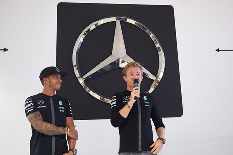 The Mercedes-Benz star looms large behind Nico and Lewis at Silverstone 2015