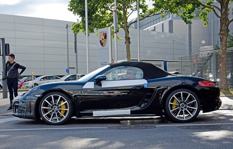 Flat-four turbocharged engines nestling under this Boxster's metalwork