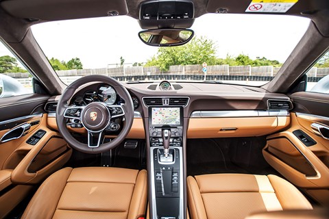 Steering wheel based on 918 Spyder takes on more functions and lowers the button count elsewhere. New nav screen arrives in 21st century at last