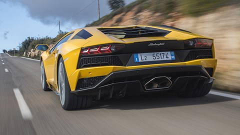 Rear-steer means revised rear suspension components