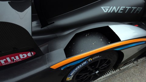 Cut-outs above the tyres are mandated by regulations