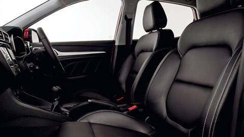 Front seats in a disappointingly cheap interior