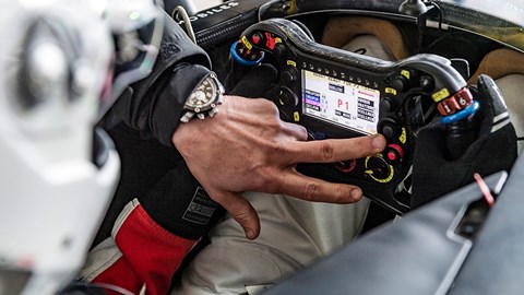 The business end: steering wheel in Formula E racer laced with controls, buttons