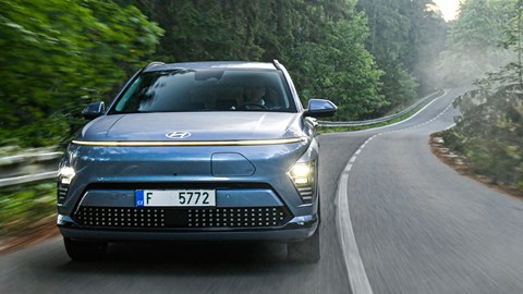 Hyundai Kona Electric review - front, driving round corner