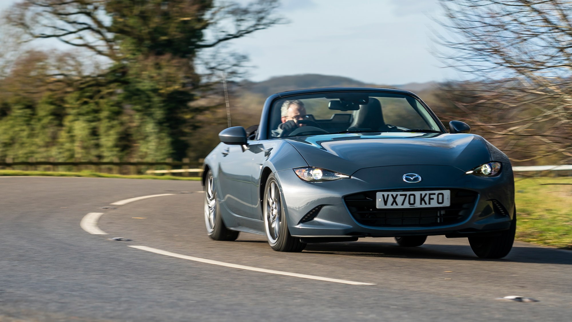 Mazda MX-5 review, front view, driving round corner