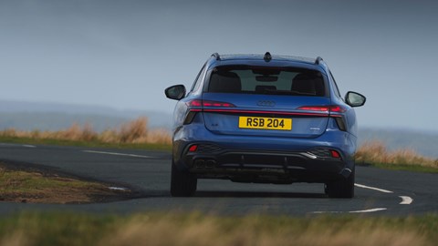 Audi A6 Avant review - UK, blue, rear, driving round corner