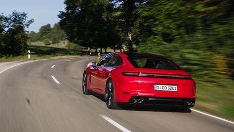 Porsche Panamera GTS: rear three quarter tracking, red paint