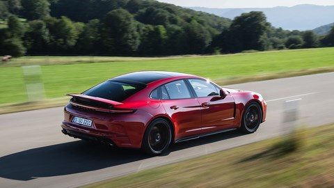 Porsche Panamera GTS: rear three quarter tracking, red paint, high angle