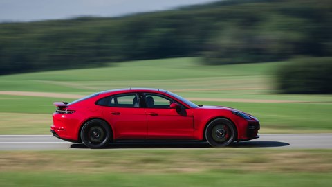 Porsche Panamera GTS: side view pan shot, red paint