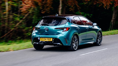 Toyota Corolla review - rear, teal, driving