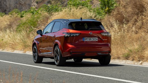 Nissan Qashqai e-Power (2025) review: rear three quarter driving, red paint