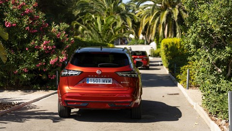 Nissan Qashqai e-Power (2025) review: rear driving, red paint, leafy road
