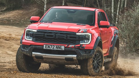 Ford Ranger Raptor (2023) review: front cornering on dirt, orange paint