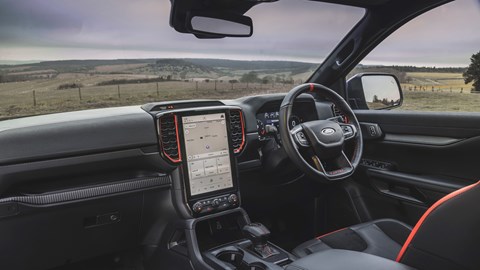Ford Ranger Raptor (2023) review: dashboard and infotainment, passenger-side view, black upholstery