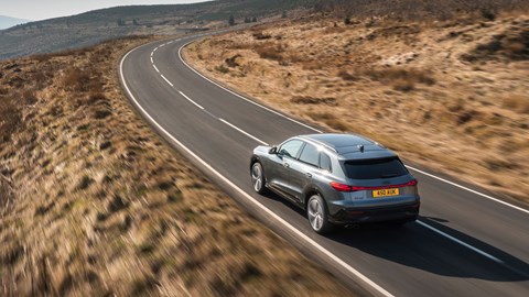 Audi SQ5 review - top rear, grey, driving fast with blur uphill