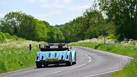 Morgan Plus Six review - rear view, blue, driving on country road, exclusive Bauer image