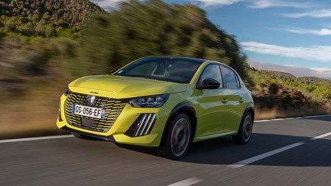 Peugeot E-208 review - front, yellow, driving