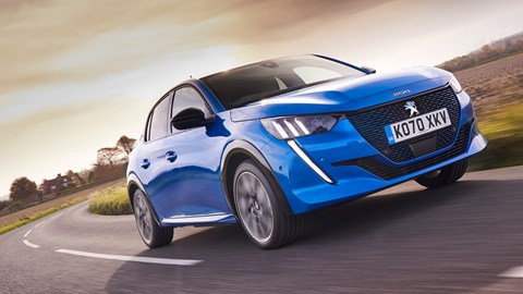 Peugeot e208 range - driving round corner, front, blue