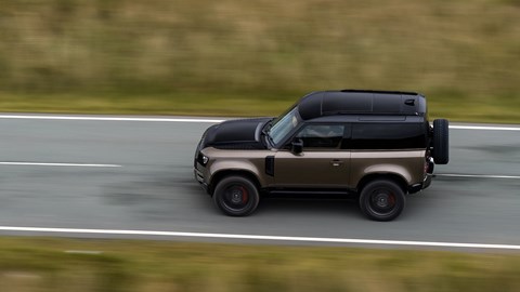 Gold 2021 Land Rover Defender 90 X P400 driving viewed from above