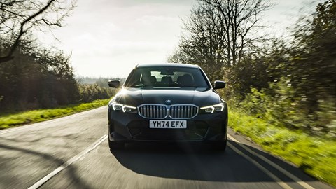 BMW 330e (2024) review: front driving, grey paint