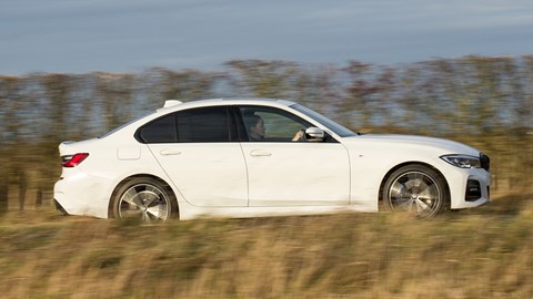 BMW 330e review - plug-in hybrid BMW, white, saloon, side view, driving