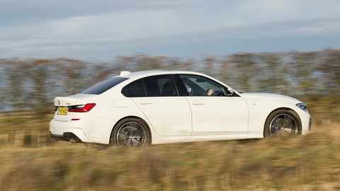 BMW 330e review - plug-in hybrid BMW, white, saloon, rear view, driving