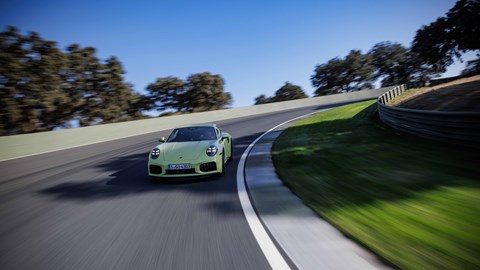 Porsche (992.2) 911 Turbo S driving front three-quarter