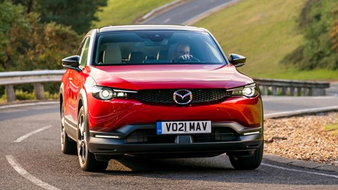 Red 2021 Mazda MX-30 driving