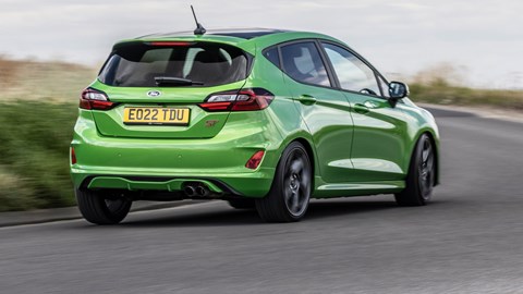 Ford Fiesta ST review - rear, Mean Green, driving round corner