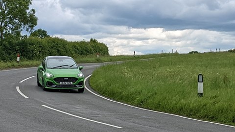 Ford Fiesta ST 2022 facelift five-door, front view, Mean Green, ST-3, driving round corner