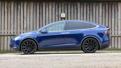 Side profile of a blue Tesla Model X