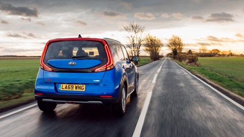 Kia Soul EV review, rear view, driving, blue
