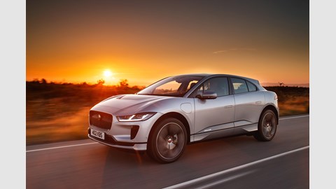 Jaguar i-Pace review - front, silver, driving at sunset