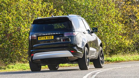Land Rover Discover (2025) review: rear three quarter cornering, black paint
