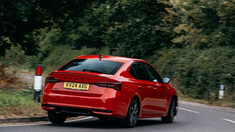 Skoda Octavia Hatch review - facelift, rear, red, Sportline, driving round corner