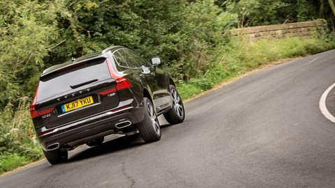 Volvo XC60 hybrid review - T8 Twin Engine plug-in driven, rear view, black, driving round corner, 2020