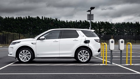 White Land Rover Discovery Sport P300e on charge