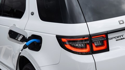 White Land Rover Discovery Sport P300e on charge